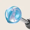 Close-up of the blending attachment of a hand blender, with blue swirling light effects indicating its operation. Produktbild-Vorschau
