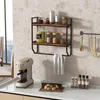 A wall-mounted shelf unit with kitchen items and a coffee machine on a countertop. Produktbild-Vorschau