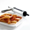 A pastry press and a plate of churros. Podgląd zdjęcia produktu