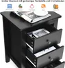 A black nightstand with three drawers is shown, with items like magazines and a framed picture inside the drawers. The top of the nightstand has a magazine and a plate on it. Above the nightstand, there are icons and text describing storage space and uses. Podgląd zdjęcia produktu