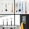 A collage of images showing adhesive hooks holding various kitchen utensils and a towel. Produktbild-Vorschau