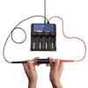 A battery charger with probes being held by hands. Voir les images du produit