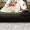 A person hugging a white dog in a pet bed. Podgląd zdjęcia produktu