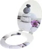 An open toilet seat with a decorative image of stacked stones and a purple flower. Produktbild-Vorschau