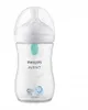 A Philips Avent baby bottle with a clear body, white nipple, and a green valve. It has a white cap and features two small elephant illustrations at the bottom. The brand name 'PHILIPS AVENT' is printed on the bottle. Produktbild-Vorschau