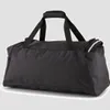 A black PUMA sports bag is shown against a light gray background. Náhľad obrázku produktu