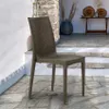 An outdoor patio setting with a single chair. Produktbild-Vorschau