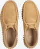A top-down view of a pair of brown Clarks clogs. Voir les images du produit