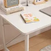 A white desk with books, a notebook, and a laptop. Anteprima dell’immagine prodotto
