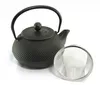 A black cast iron teapot and a metal tea strainer are displayed on a white background. Podgląd zdjęcia produktu