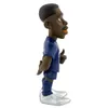 A figurine of a soccer player in a blue uniform, shown from the side. Anteprima dell’immagine prodotto