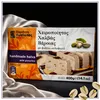 Kandylas Halva mit Pistazien 400 g Verpackung auf silbernem Stoff im dunklen Setting Produktbild-Vorschau