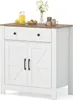 A white sideboard with a brown countertop and two cabinet doors with barn door style detailing. Náhľad obrázku produktu