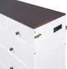 A close-up view of the side and top of a white dresser with a dark brown wooden top. Produktbild-Vorschau