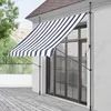 An awning is extended over a sliding glass door on a house. Anteprima dell’immagine prodotto