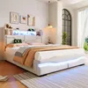 A modern bedroom with a white upholstered bed frame featuring LED lighting and a headboard with shelves. Náhľad obrázku produktu