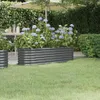 A raised garden bed filled with purple flowers in a garden setting. Produktbild-Vorschau