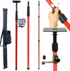 A collection of laser leveling poles and accessories displayed against a white background. Náhled obrázku produktu