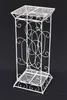 A white metal plant stand against a black background. Anteprima dell’immagine prodotto