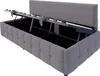 A dark gray upholstered bed frame with the mattress support mechanism open, revealing the storage space underneath. Anteprima dell’immagine prodotto