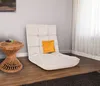 A floor chair with a pillow sits next to a side table in a room with a window and curtains. Produktbild-Vorschau