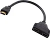 A black HDMI splitter cable with one male connector and two female connectors. Náhled obrázku produktu