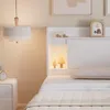 A bedroom scene with a bed, nightstand, and hanging lamp. Náhled obrázku produktu