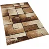 A rectangular rug with a geometric pattern is shown from a slightly elevated angle. Náhled obrázku produktu