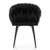 A black velvet chair with a distinctive textured back and four black legs, shown from the front against a white background. Náhľad obrázku produktu