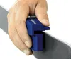 A hand is holding a blue ski edge sharpener against a ski. Podgląd zdjęcia produktu