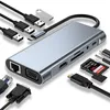 A USB C hub and various cables are arranged around it on a white background. Produktbild-Vorschau