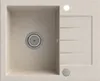 A top-down view of a beige granite kitchen sink with a drainer. Podgląd zdjęcia produktu