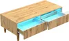 A modern coffee table with two drawers, illuminated by blue LED lights. Produktbild-Vorschau