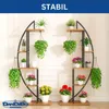 Two modern, semi-circular plant stands filled with various potted plants, displayed indoors against a white wall. Produktbild-Vorschau