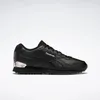 A black Reebok sneaker with silver accents on a white background. Voir les images du produit