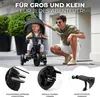 A father and child are on a street with a tricycle. Produktbild-Vorschau