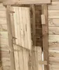 Close-up view of the wooden doors of a playhouse, one door is open. Produktbild-Vorschau