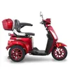 A red electric mobility scooter with a top case, shown in a studio setting against a white background. Produktbild-Vorschau