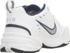A close-up side view of a white Nike Air Monarch IV sneaker. Produktbild-Vorschau