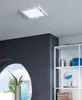 A modern bathroom with a ceiling light, mirror, and shelving unit. Produktbild-Vorschau
