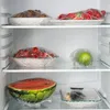 Inside a refrigerator, with shelves holding various food items covered in plastic wrap. Produktbild-Vorschau