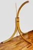 A wooden hammock stand is shown against a white wall and on a wooden floor. Produktbild-Vorschau