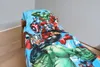 A close-up view of a child's bed with Avengers-themed bedding. Produktbild-Vorschau