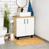A bathroom scene featuring a vanity with a sink, mirror, and toilet. A bamboo bath mat is in the foreground. Voir les images du produit