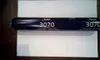A dark blue tube of Bostik 3070 spray cork sealant is lying horizontally on a white surface. Produktbild-Vorschau