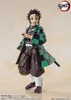 A full-body shot of an action figure of Tanjiro Kamado from Demon Slayer, standing against a light beige background. Podgląd zdjęcia produktu