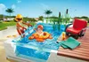 A Playmobil scene of a family enjoying a swimming pool on a sunny day. Voir les images du produit