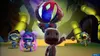 A group of characters from the video game Sackboy: A Big Adventure are gathered in a colorful, stylized environment. Produktbild-Vorschau