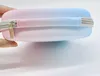A close-up side view of a protective case with a zipper, showing a gradient of pink to blue. Produktbild-Vorschau