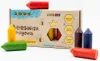 A box of beeswax crayons with several crayons scattered around it. Náhľad obrázku produktu